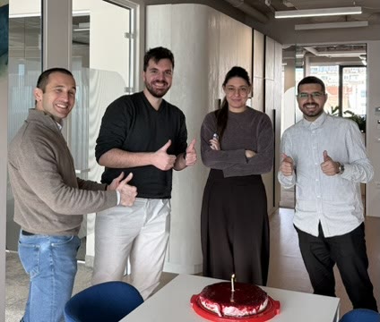 Tanishpreet and colleagues celebrating together at the office