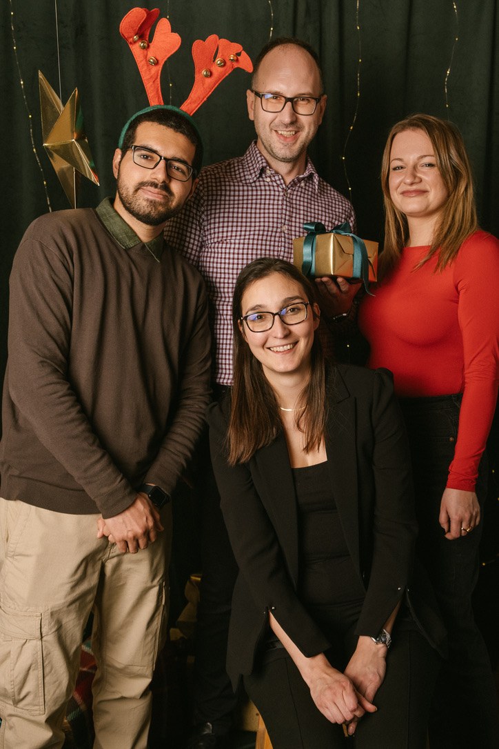 Tanishpreet with colleagues at a holiday gathering